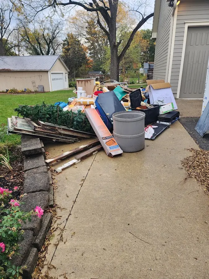 Dumpster being loaded with debris for 3 Yard Dumpster Rental in Eldersburg